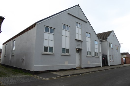 HER 8427a front and side (south) elevation.jpg